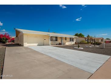 Charming single-story home with a well-maintained front yard and attached garage at 509 N 56 St, Mesa, AZ 85205