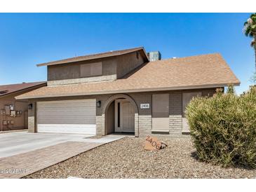 Traditional two story home features a two car garage and a covered front entryway at 2406 S Mulberry --, Mesa, AZ 85202