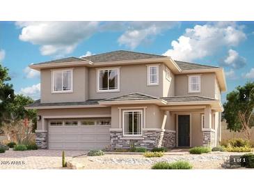 Charming two-story home featuring a two-car garage and tasteful stone accents on the facade and manicured landscaping at 21878 E Bonanza E Ct, Queen Creek, AZ 85142