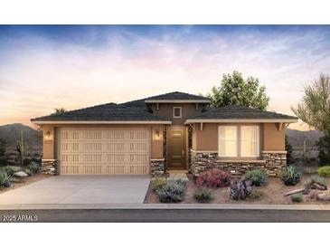 Charming single-story home featuring a 2-car garage, beautiful stone accents, and desert landscaping at 13518 W Copperleaf Ln, Peoria, AZ 85383