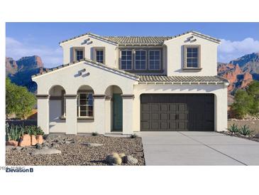 Charming two-story home features a neutral palette, desert landscaping, and a two-car garage at 7339 W Buckhorn Trl, Peoria, AZ 85383