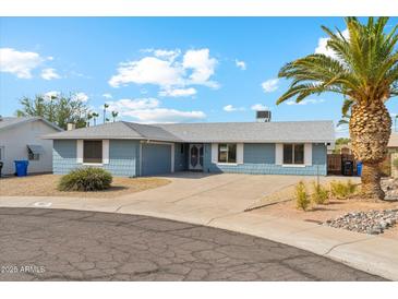 Charming single-story home featuring a well-maintained yard and inviting curb appeal at 4829 E Apache Cir, Phoenix, AZ 85044