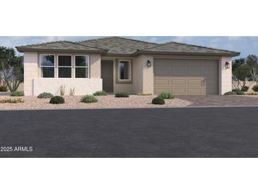 Charming single-story home with a two-car garage, neutral stucco, and well-maintained desert landscaping at 5610 W Hopi Trl, Laveen, AZ 85339