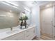 Stylish bathroom featuring double sinks, quartz counters, and a tiled shower at 3131 N Central Ave # 6011, Phoenix, AZ 85012