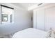Bright bedroom features a large window, closet doors, and natural light at 3131 N Central Ave # 6011, Phoenix, AZ 85012