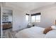 Bright bedroom with large windows offering city views, and simple, elegant furniture at 3131 N Central Ave # 6011, Phoenix, AZ 85012