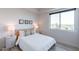 Charming bedroom with a window view and stylish furnishings and lamps at 3131 N Central Ave # 6011, Phoenix, AZ 85012
