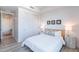 Bright bedroom features natural light, closet doors, and modern decor at 3131 N Central Ave # 6011, Phoenix, AZ 85012