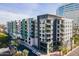Modern apartment building with colorful accents, balconies, and palm tree landscaping at 3131 N Central Ave # 6011, Phoenix, AZ 85012