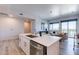 Bright kitchen with stainless steel appliances and an island, flowing into a living area at 3131 N Central Ave # 6011, Phoenix, AZ 85012