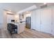 Bright kitchen features stainless appliances, white cabinets, and a large island with bar seating at 3131 N Central Ave # 6011, Phoenix, AZ 85012
