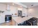 Modern kitchen featuring stainless steel appliances, a large island with seating, and white cabinetry at 3131 N Central Ave # 6011, Phoenix, AZ 85012