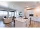 Well-lit kitchen featuring white cabinets, stainless steel appliances, and an island with seating at 3131 N Central Ave # 6011, Phoenix, AZ 85012