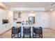 Contemporary kitchen with white cabinetry, stainless steel appliances, and a kitchen island with bar stools at 3131 N Central Ave # 6011, Phoenix, AZ 85012