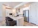 Spacious kitchen with white cabinets, stainless steel appliances, and a large center island at 3131 N Central Ave # 6011, Phoenix, AZ 85012