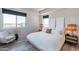 Serene main bedroom with neutral tones, bright windows, designer lighting, and modern decor at 3131 N Central Ave # 6011, Phoenix, AZ 85012