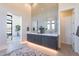 Double vanity bathroom with modern finishes and a view at 8366 E Old Paint Trl, Scottsdale, AZ 85266