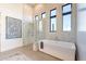 Elegant bathroom featuring a soaking tub and walk-in shower at 8366 E Old Paint Trl, Scottsdale, AZ 85266