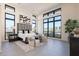 Spacious bedroom with large windows and gray headboard at 8366 E Old Paint Trl, Scottsdale, AZ 85266