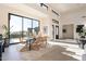 Elegant dining room with large windows and a view of the backyard at 8366 E Old Paint Trl, Scottsdale, AZ 85266