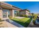 Modern home with a landscaped front yard and water feature at 8366 E Old Paint Trl, Scottsdale, AZ 85266