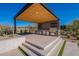 Outdoor kitchen with built-in appliances and pergola at 8366 E Old Paint Trl, Scottsdale, AZ 85266