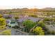 Aerial view showcasing the home's desert landscaping, pool, and solar panels at 12797 S 179Th Dr, Goodyear, AZ 85338