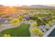 Desert home near golf course with mountain views. Well landscaped with mature trees and circular driveway at 12797 S 179Th Dr, Goodyear, AZ 85338