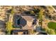 This single Gathering home features a private pool, outdoor living area, putting green, and desert landscaping at 12797 S 179Th Dr, Goodyear, AZ 85338