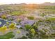 Expansive aerial view of a desert home near a golf course with mountain views at 12797 S 179Th Dr, Goodyear, AZ 85338