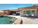 Luxurious backyard featuring a pool, spa, and covered patio with comfortable seating at 12797 S 179Th Dr, Goodyear, AZ 85338