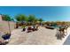 Desert backyard features a pool with water feature, putting green, and mountain views at 12797 S 179Th Dr, Goodyear, AZ 85338