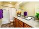 Bathroom featuring vanity with sink, tile flooring, framed mirror and a shower tub combination at 12797 S 179Th Dr, Goodyear, AZ 85338