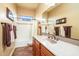 Bathroom with a shower-tub combo, granite countertops, and decorative accents at 12797 S 179Th Dr, Goodyear, AZ 85338