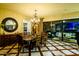 Charming dining room with chandelier lighting, decorative flooring, and sliding glass doors at 12797 S 179Th Dr, Goodyear, AZ 85338