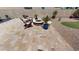 Relaxing outdoor space with a charming firepit surrounded by chairs and lush landscaping at 12797 S 179Th Dr, Goodyear, AZ 85338