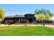 Single-story home with well-manicured lawn and desert landscaping, offering great curb appeal at 12797 S 179Th Dr, Goodyear, AZ 85338