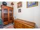 Hallway featuring wooden furniture and decorative items at 12797 S 179Th Dr, Goodyear, AZ 85338