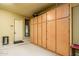 Organized garage with ample cabinet storage space, providing a clean and functional area at 12797 S 179Th Dr, Goodyear, AZ 85338