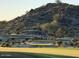 Scenic golf course view with desert foliage and mountain backdrop at 12797 S 179Th Dr, Goodyear, AZ 85338