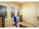 Bright home gym with exercise equipment and plantation shutters for natural light at 12797 S 179Th Dr, Goodyear, AZ 85338