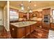 Spacious kitchen with a large center island, stainless steel appliances, and custom cabinetry at 12797 S 179Th Dr, Goodyear, AZ 85338
