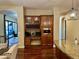 Gourmet kitchen featuring custom cabinets, wine storage, and stainless steel appliances at 12797 S 179Th Dr, Goodyear, AZ 85338