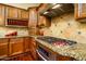 Beautiful kitchen featuring stainless steel appliances, custom cabinets and granite countertops at 12797 S 179Th Dr, Goodyear, AZ 85338