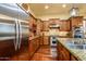 Gourmet kitchen with stainless steel appliances, granite countertops, and ample cabinet space at 12797 S 179Th Dr, Goodyear, AZ 85338