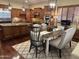 Modern kitchen and dining area with stainless steel appliances, hardwood floors, and bright natural light, perfect for cooking and dining at 12797 S 179Th Dr, Goodyear, AZ 85338