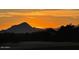 Scenic desert landscape featuring a mountain silhouette at sunset at 12797 S 179Th Dr, Goodyear, AZ 85338