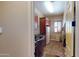 Laundry room featuring a utility sink, storage cabinets, and tile flooring at 12797 S 179Th Dr, Goodyear, AZ 85338
