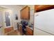 A spacious laundry room features a sink, washer, dryer, refrigerator, and ample cabinet space, combining functionality and storage at 12797 S 179Th Dr, Goodyear, AZ 85338