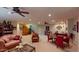 Spacious living area with comfortable seating, a decorative ceiling fan, and ample space for entertaining and relaxation at 12797 S 179Th Dr, Goodyear, AZ 85338